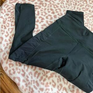 Fabletics Mila leggings in dark military green. The blue is from the website.
